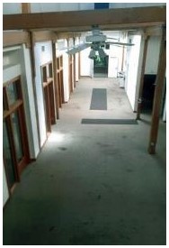 Before: typical corridor space in offices before construction